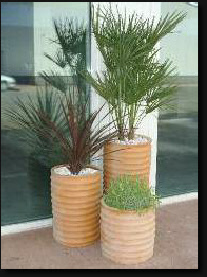 Tall round ribbed planter in terracotta colour